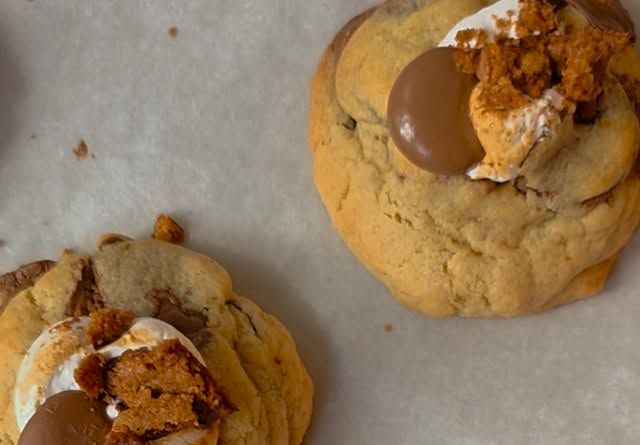 S'mores style cookies topped with marshmallow and chocolate